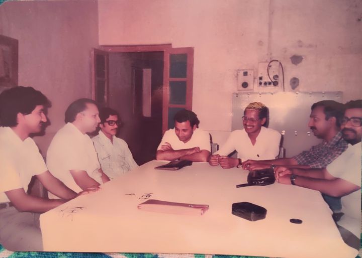 Medicine department seminar, MGIMS Sevagram, 1984. Left to right: Dr. R.P. Singh, Dr. A.P. Jain, Dr. Vivek Poflee, Dr. Ulhas Jajoo, Dr. S.P. Kalantri, Dr. Ashish Kulkarni, and Dr. Atul Agrawal. Old hospital building.
