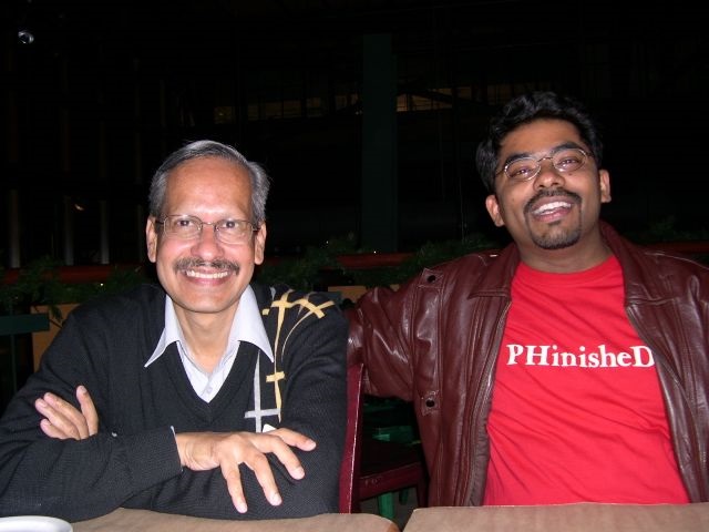 Dr. S.P. Kalantri with Dr. Madhukar Pai at UC Berkeley, 2005. Dr. Pai wearing his "PHinisheD" t-shirt — a play on PhD finished. The friendship that initiated Dr. Kalantri into evidence-based medicine.