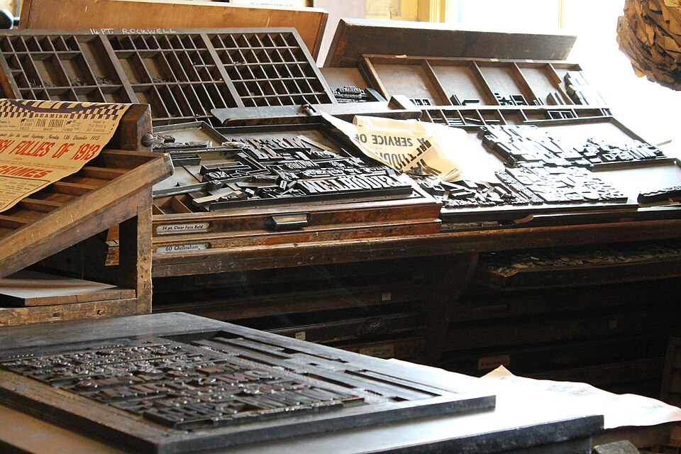 Letterpress metal type and composing frames at a printing press, India 1980s