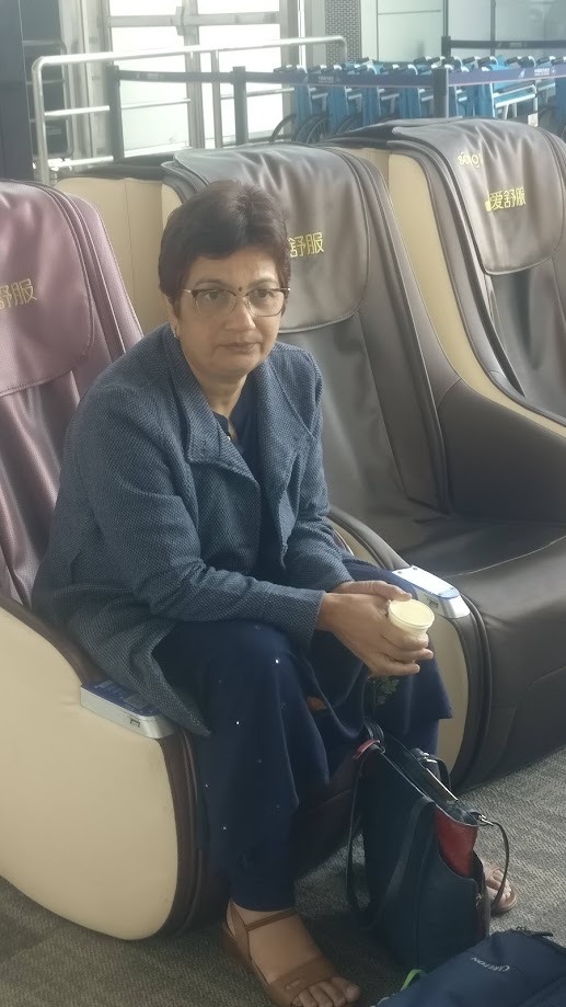 Bhavana Kalantri stranded at Guangzhou Baiyun International Airport, China, 2019. She and Dr. S.P. Kalantri missed their connecting flight to Vancouver after failing to adjust their watches to Chinese local time. They were stranded for 24 hours en route to visit their daughter Amrita in Canada.