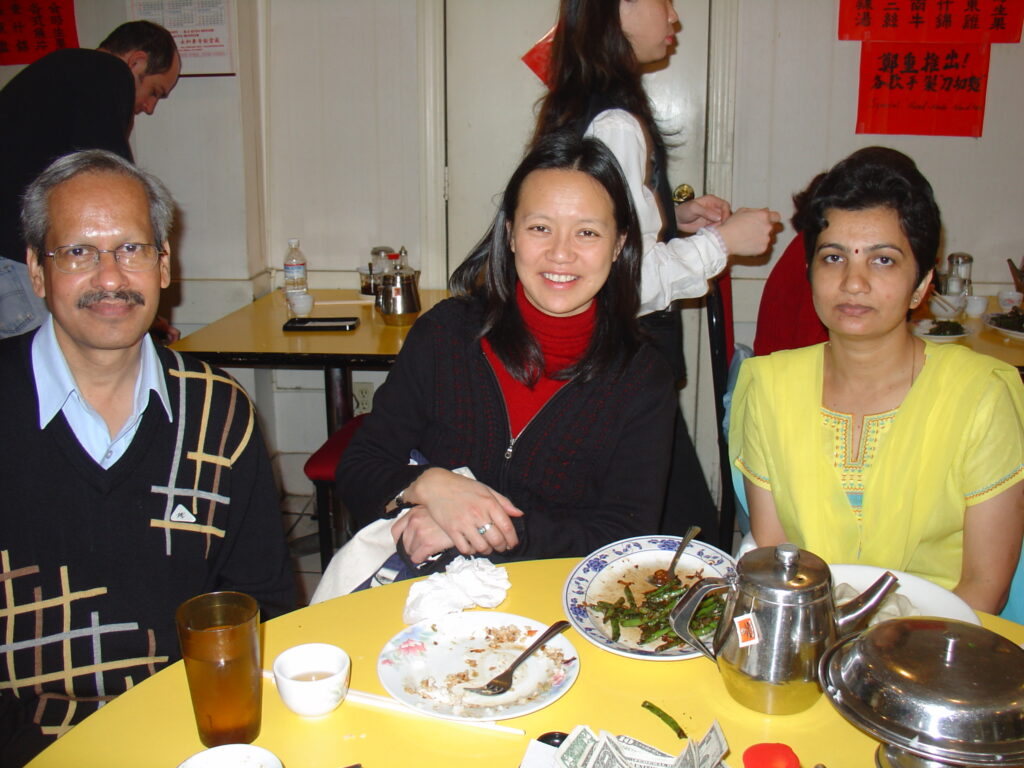 Dr. S.P. Kalantri, Christine Ho, and Bhavana Kalantri at a Chinese restaurant in the Bay Area, Berkeley, December 2004. Christine was Dr. Kalantri's MPH classmate at UC Berkeley. She later visited Sevagram multiple times over the following two decades and stayed with the Kalantri family.