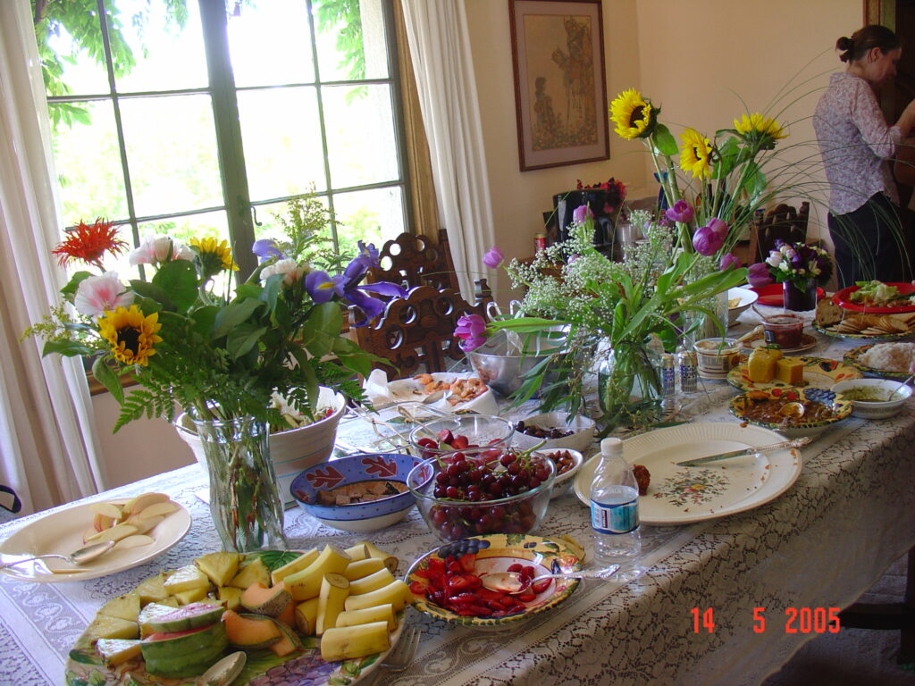 Lunch party for teachers hosted by Dr. Shriprakash Kalantri, Maureen, Christine and Joseph at Berkeley, California, after UC Berkeley graduation, May 2005, with Indian food from Vicks restaurant laid out on dining table