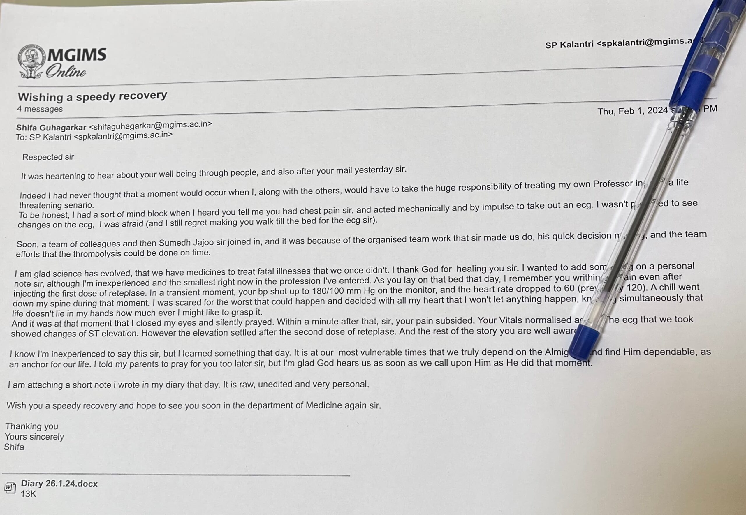 A printed copy of Dr. Shifa Guhagarkar's letter to Dr. S.P. Kalantri, written after his heart attack on Republic Day 2023, lying on a wooden surface with a pen beside it.