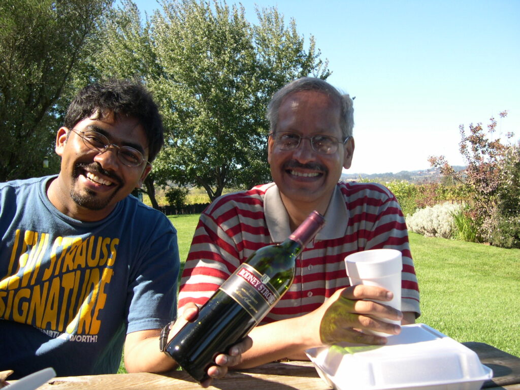 Dr. S.P. Kalantri and Dr. Madhukar Pai at a winery in Sonoma or Napa Valley, California, 2004. Dr. Pai was Dr. Kalantri's mentor, friend, and the person whose chance meeting at a Medico Friends Circle gathering in Sevagram led directly to Dr. Kalantri's MPH at UC Berkeley.