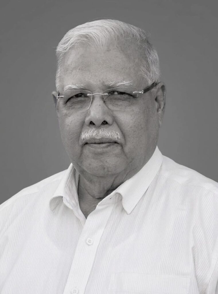 Black and white portrait image of Mr. P.L. Tapdiya, president of Kasturba Health Society, Sevagram