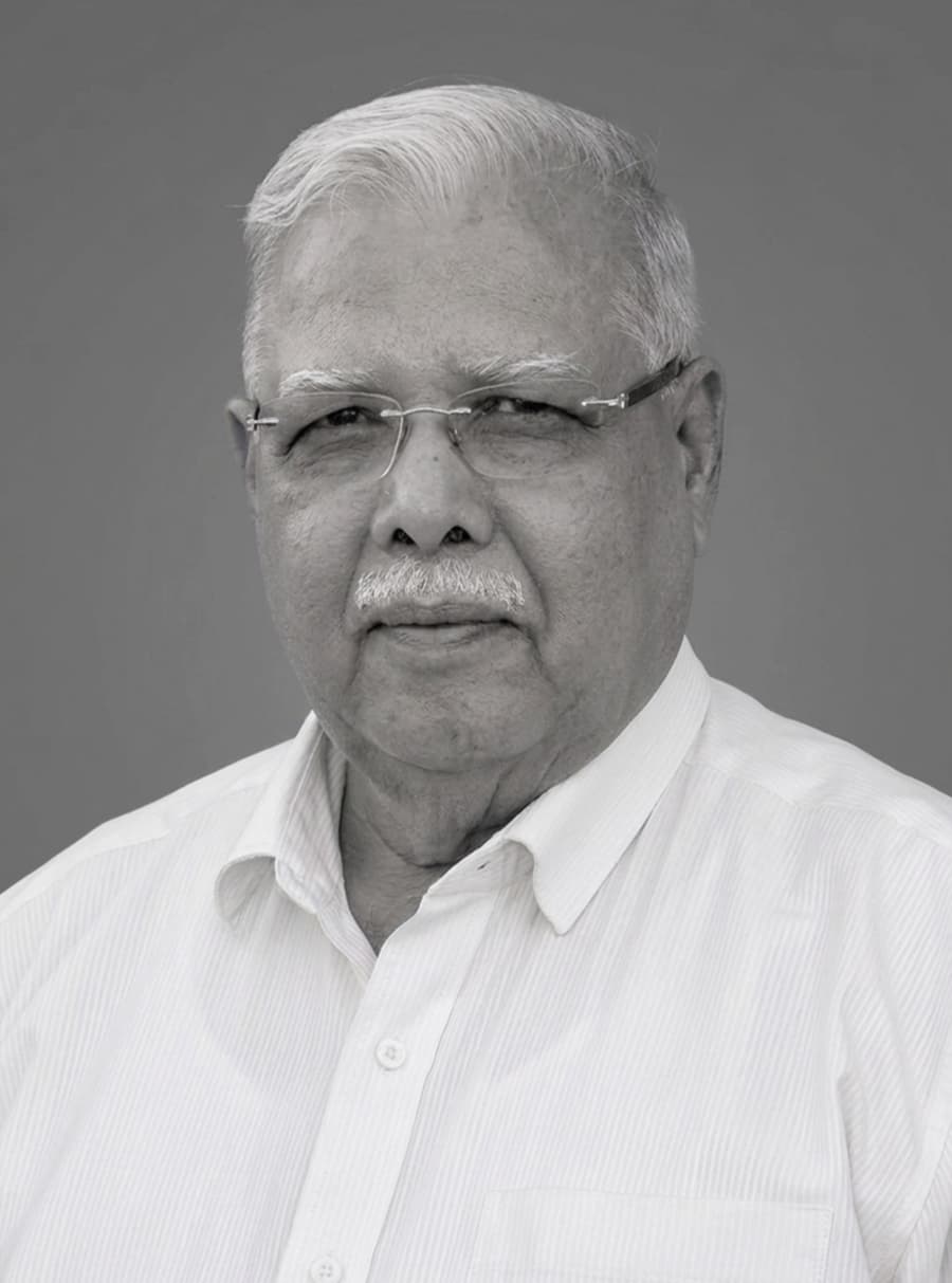 Black and white portrait image of Mr. P.L. Tapdiya, president of Kasturba Health Society, Sevagram