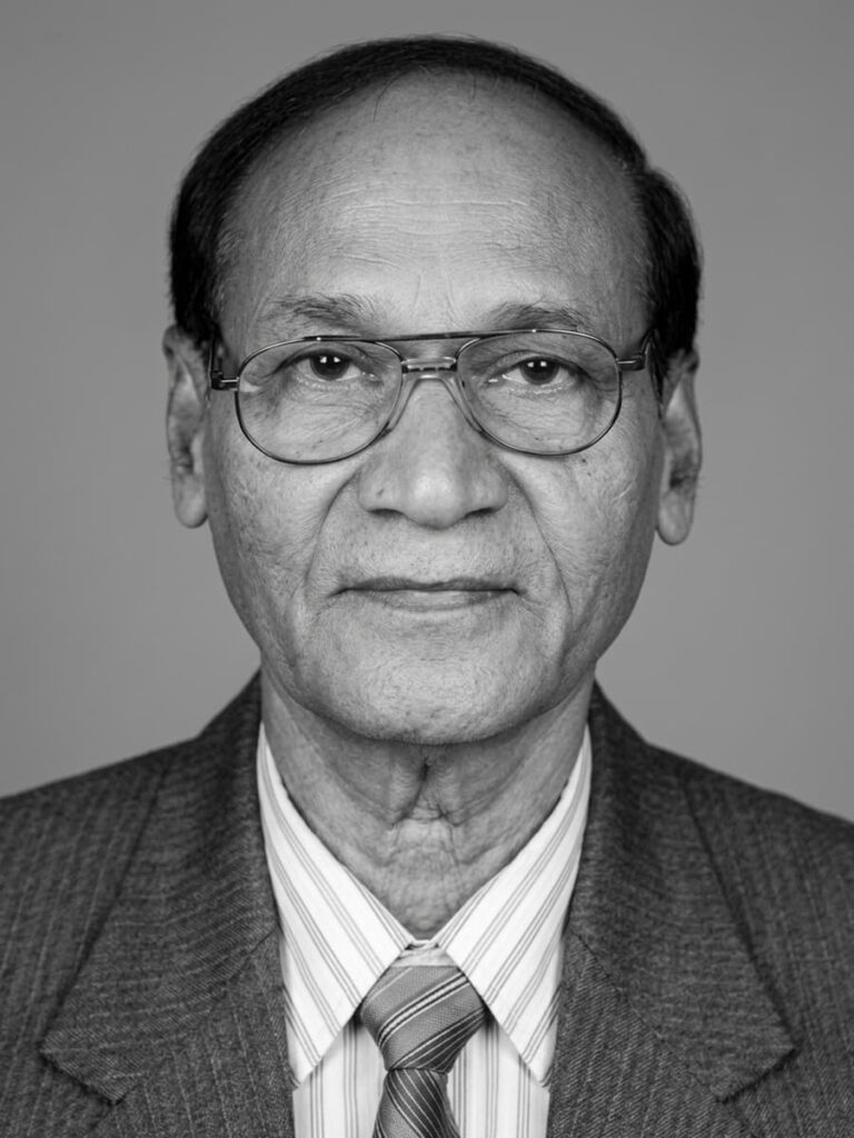Black and white portrait image of Dr. R.S. Naik. Professor and Head of Forensic Medicine at MGIMS Sevagram