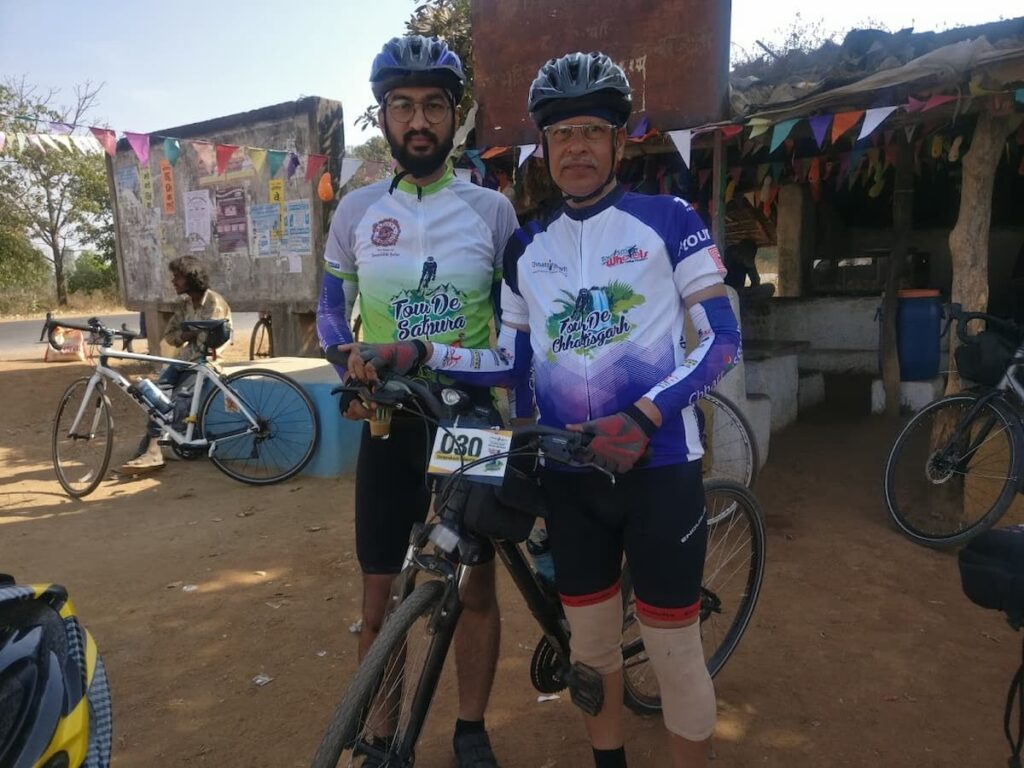 SP Kalantri in Tour de Chhattisgarh jersey and Ashwini in Tour de Satpura jersey, with their bicycles at a village stop during the Tour de Chhattisgarh, Chhattisgarh, 2018.