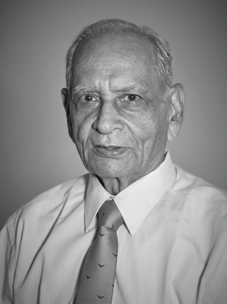 Black and white portrait of Dr. B. K. Mahajan. professor and head of community medicine MGIMS during the 1970s.