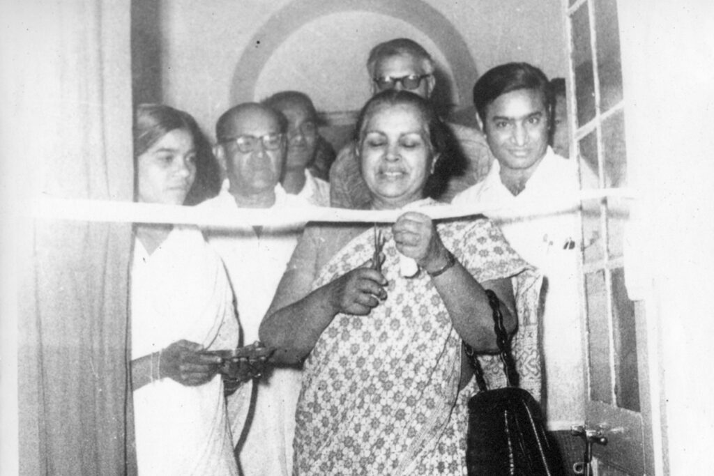 Dr. Sushila Nayar cutting the ribbon for an eye camp in Pugaon, Dr. Sudershan Dhawan to her left and Dr. Rajkumar behind.